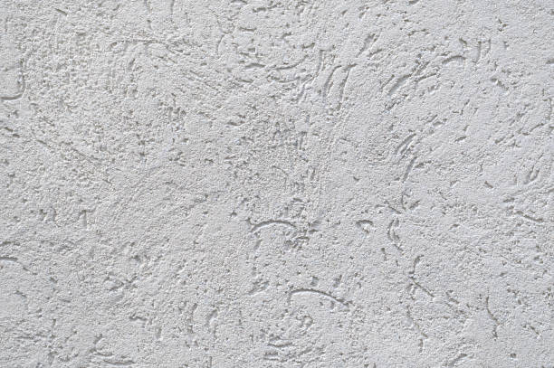 istock The surface of rough decorative sand-colored plaster 1443440020