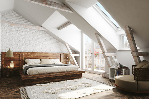Interior of a Scandinavian style attic bedroom.