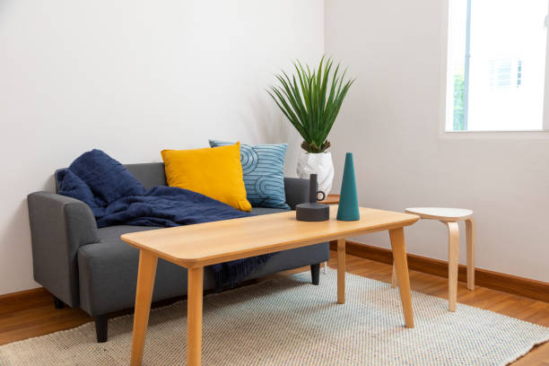 istock Modern living room with blue and yellow pillow on sofa. 1443441296
