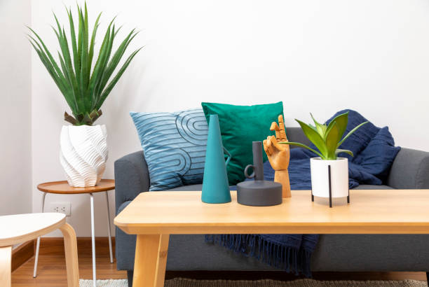 istock Coffee table with plant pot and modern vase. 1443441306