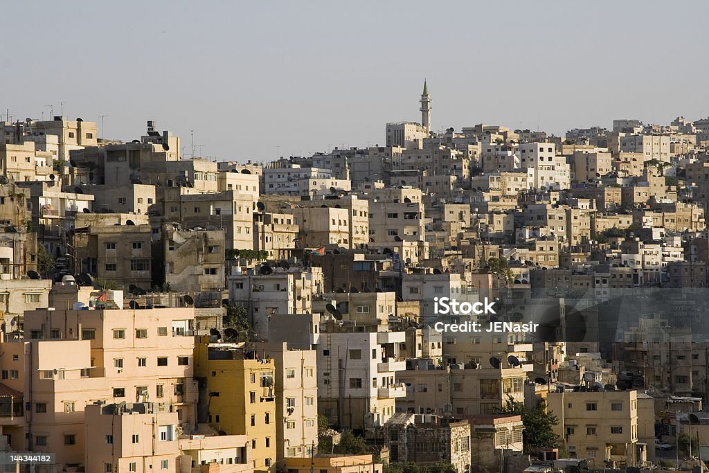 Amman Jordan - Early Evening 2 Amman is built on the mountainous top of a desert plateau, and there is very little level ground anywhere.  This picture was shot on a July evening from Jebal Amman looking toward Jebal Webdah.  (Jebal in Arabic means ""mountain."") Amman Stock Photo