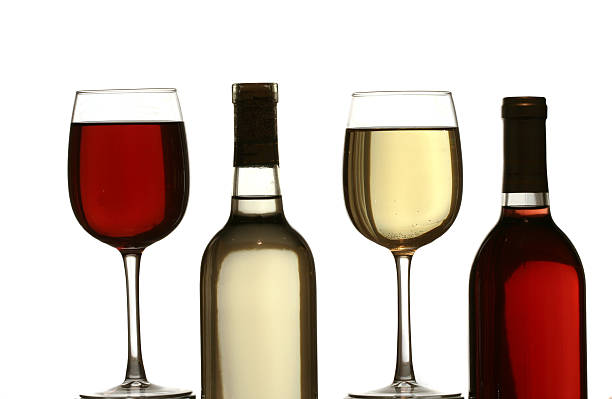 Red, White Wine Glasses and Bottles stock photo