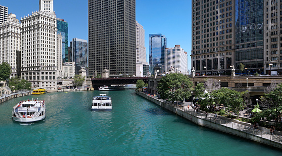 Chicago, USA - August 2022:  Tour boats on the Chicago River are a popular way to view the city's modern architecture