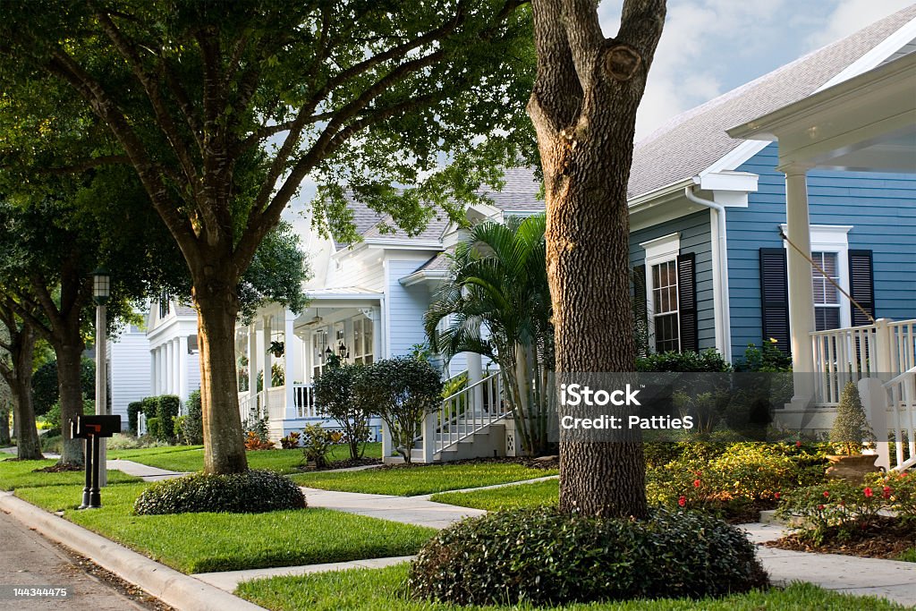 Quiet, suburban street in a small town  new urbanism - neighborhood street scene in small American town Residential District Stock Photo