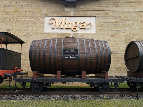 Barrel on an old train wagon at famous Bodegas Muga winery in Haro, a town in the northwest of La Rioja province in northern Spain, the most important wine town in the Rioja wine region.