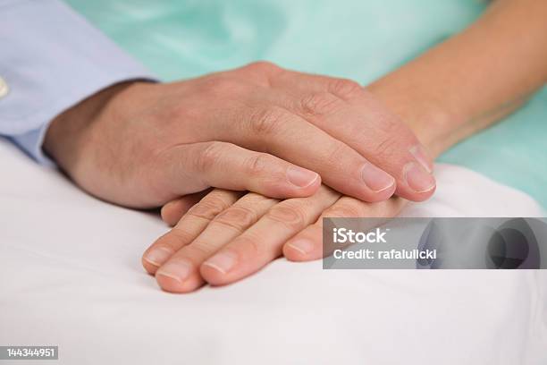Hands Clasping On Hospital Bed Stock Photo - Download Image Now - Alternative Therapy, Anticipation, Bed - Furniture