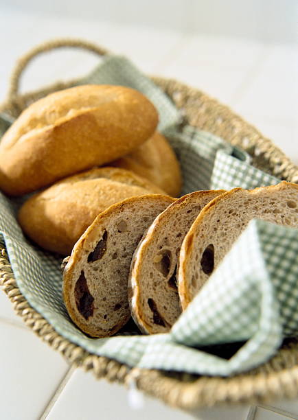 wheat bread in straw basket stock photo