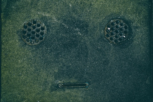 Close up Drainage Cover in Robot Face.
