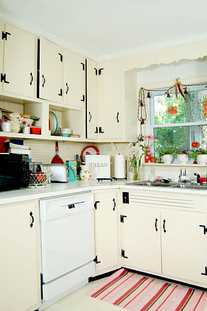 istock Interior view of a conventional kitchen with white cupboards 144345064