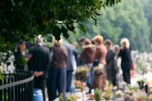 family at a burial - blommor grav bildbanksfoton och bilder