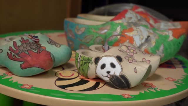 HD of the little wooden clogs with a panda
