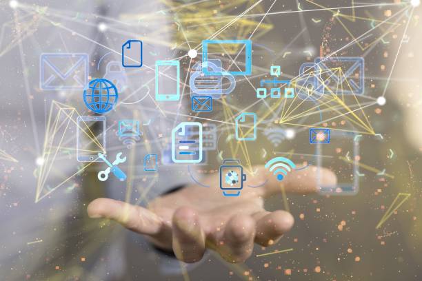 istock Man holding a floating render of media icons 1443456768