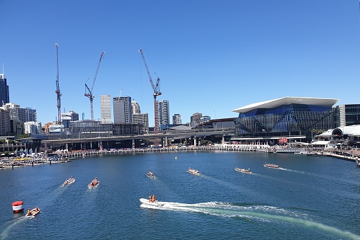 Sydney, Australia – February 09, 2022: A beautiful view of boats in the Darling harbor against a blue sky in Sydney, Australia