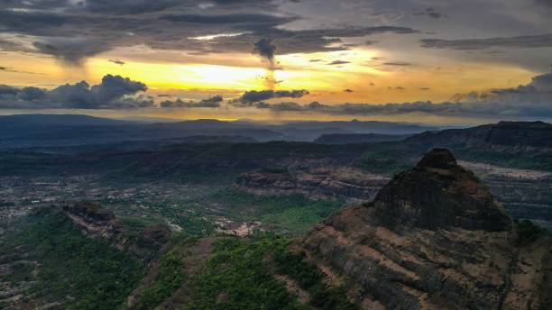 istock Rocky valley against green fields background at sunset 1443458663