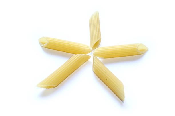 pasta - penne star composition stock photo