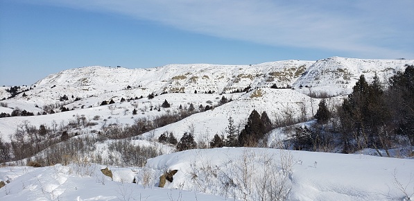 An idyllic winter landscape with picturesque snow-covered hills