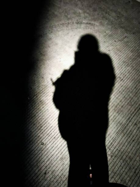 istock Black shadow on the street 1443462802
