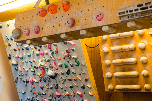 Shot of wooden finger board at a climbing gym. Finger board for practicing at indoor climbing center.