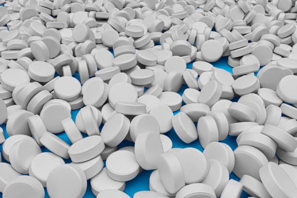 istock 3d illustration of many white round pills background 1443465719