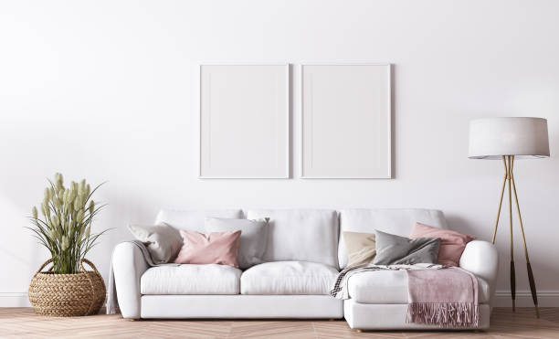 istock Poster frame mockup in modern living room design, bright interior with pink and white sofa on minimal background 1443465882