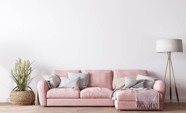 Modern living room design, bright interior with pink sofa on white minimal background stock photo