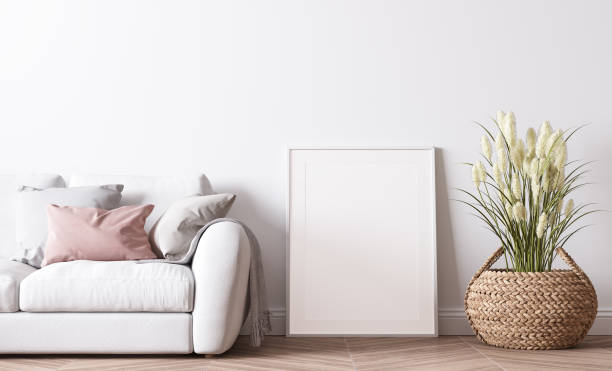 istock Poster frame mockup in modern living room design, bright interior with pink and white sofa on minimal background 1443465899