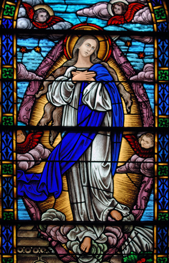 Stained glass representing Immaculate Conception from a 19th century ( built 1875 - 1899) church.