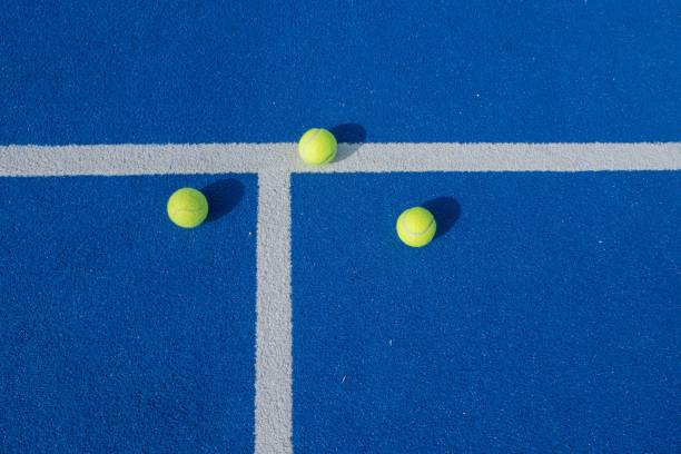 istock three padel tennis balls on a blue court 1443471549