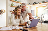 Happy pension couple with laptop and paperwork for retirement planning, online ecommerce website or digital bank application investment. Elderly, senior people for life insurance or asset management