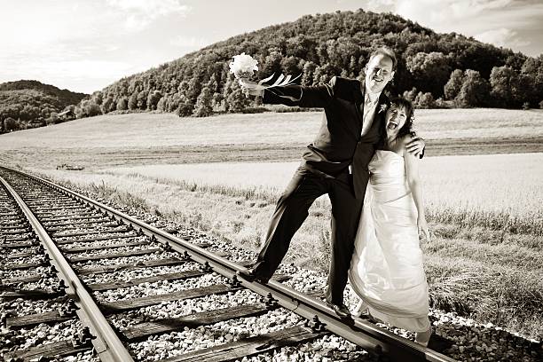 istock Bridal couple on rails, toned 144347352