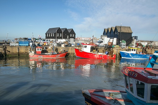 Whitstable, United Kingdom – January 20, 2019: Fishing boats moored in harbour of Whitstable, England