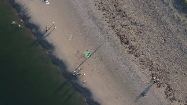 Photo of Aerial view of a small group of hikers at Ovens Natural Park in Nova Scotia, Canada