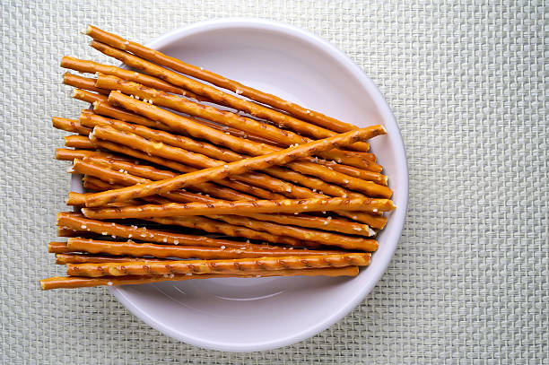 istock Breadsticks in dish over a linen napkin 144347481