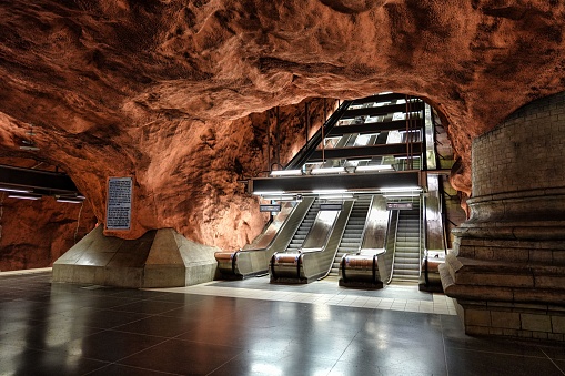 An interior of the Radhuset metro station (Tunnelbana) with an escalator in Stockholm, Sweden