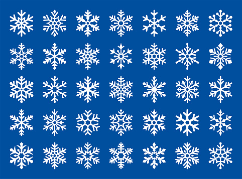 Set of vector white snowflakes on a blue background.