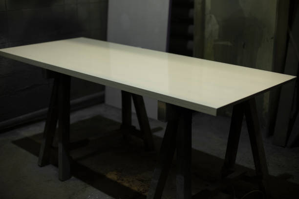 istock Board on table. White board in carpentry workshop. Details of workplace. 1443479230