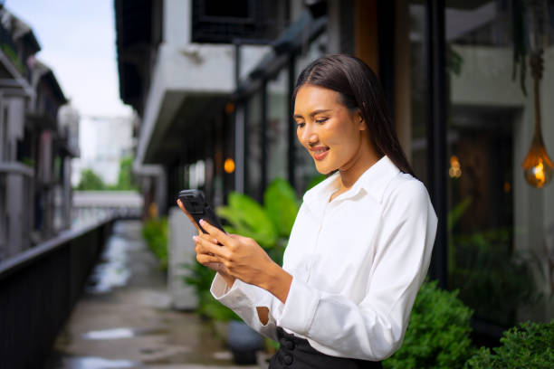 istock Young woman is using a digital device for electronic banking at public place. 1443482809