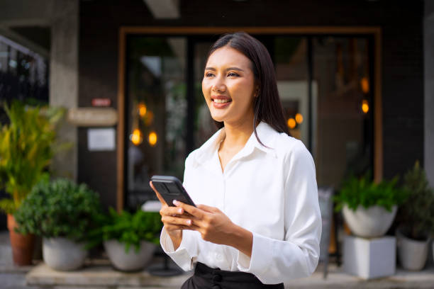 istock Young woman is using a digital device for electronic banking at public place. 1443482874