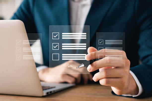 istock Electronic signature concept, business man using stylus pen to approve digital document on screen like using stylus pen, paperless office Signing future business contracts. 1443486113