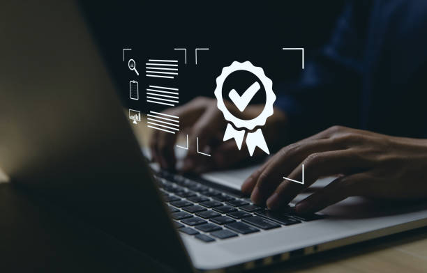 istock business people use laptops show check mark Five-star best quality guarantee 1443487383