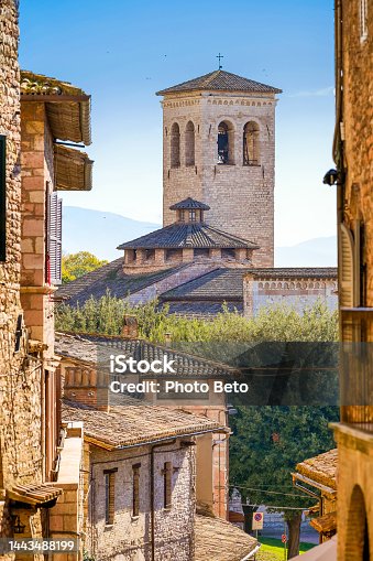 istock A glimpse of a stone alley and the Church of San Pietro in the medieval town of Assisi in Umbria 1443488199