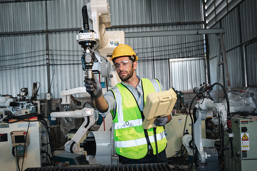 Machine Foreman Engineers Or Foreman Controls And Check The Automatic Robot Arms ...