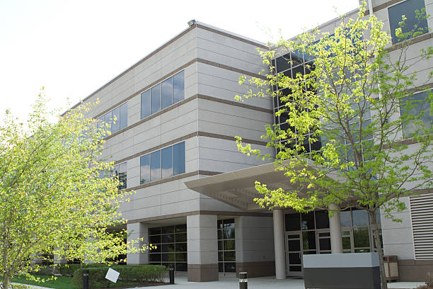 istock Three Story Modern Office Building and Trees 144349041