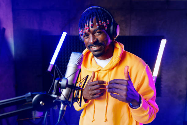 istock Young African performer recording his new track in recording studio 1443490728