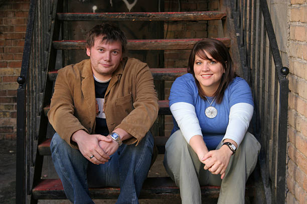 istock Young Couple Sitting on Stairs 144349120