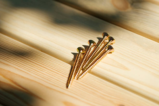 Screws on wood planks stock photo