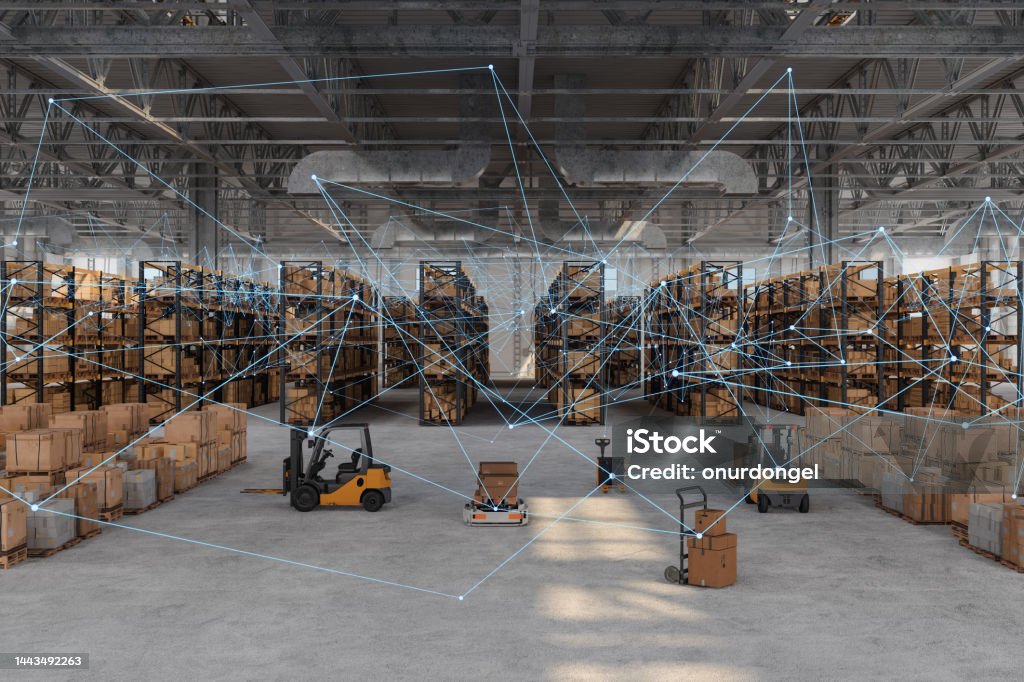 Distribution Warehouse With Plexus, Automated Guided Vehicles, Cardboard Boxes, Forklifts And Pallets. Remote Control With Mobile App And Technology Devices. Warehouse Stock Photo