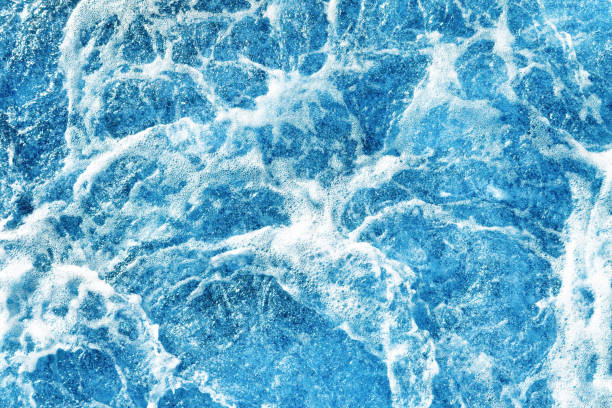 istock Ocean wave background. Bubble water backdrop. Turbulent sea texture. Messy water flow. 1443492802