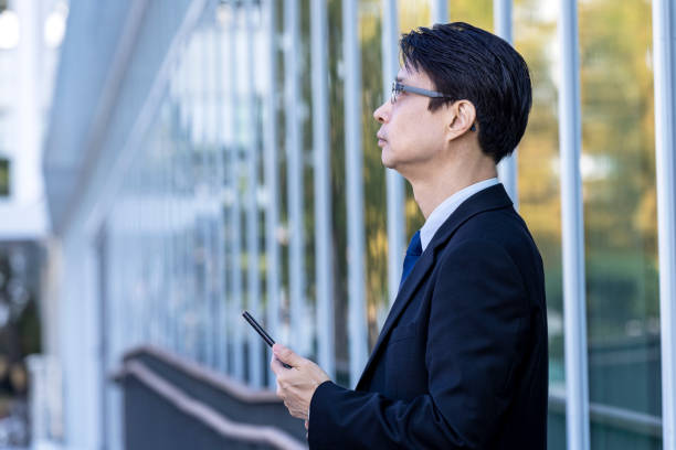 istock Asian Business Men's Work Style with Mobile Phone 1443493540