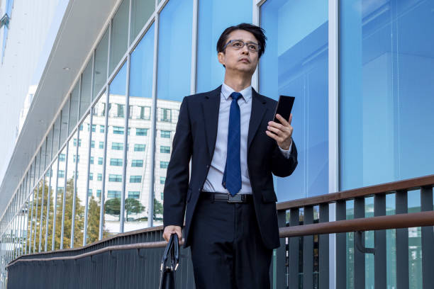 istock Asian Business Men's Work Style with Mobile Phone 1443493603